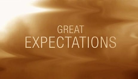 A gold background with the words great expectations