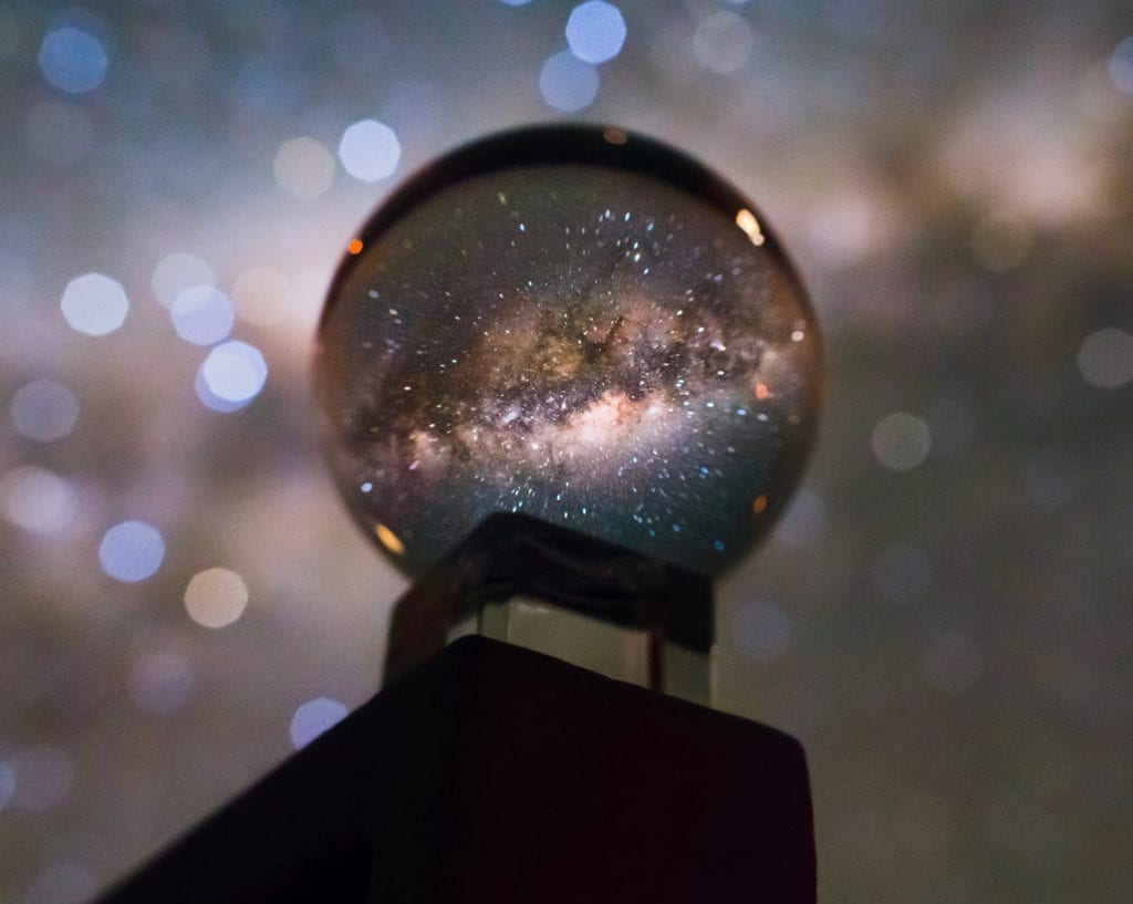 A glass ball with the stars in it